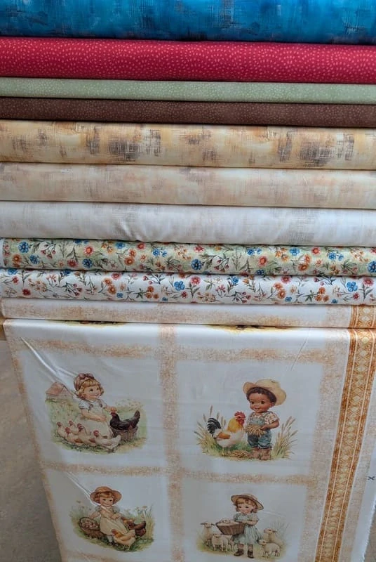 Látka na patchwork luční kvítí na zelenkavé makaté