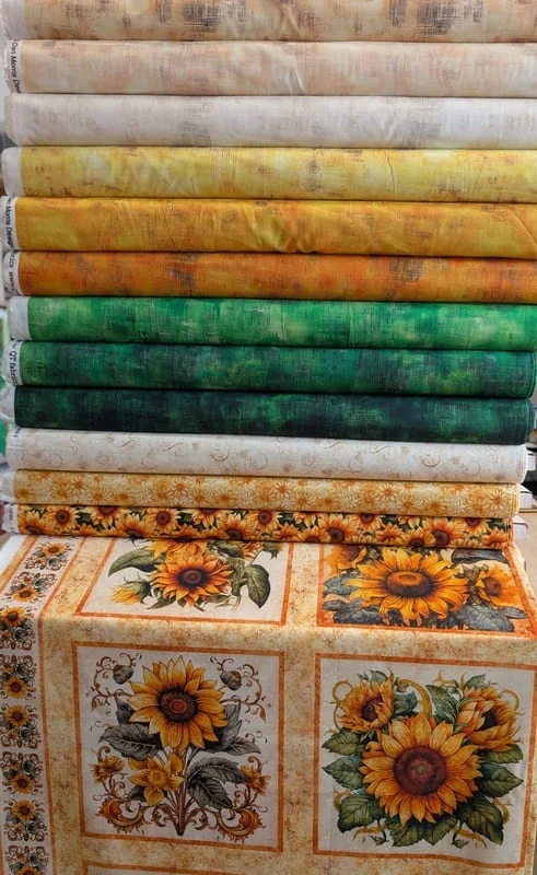 Látka na patchwork malé slunečnice na žluté