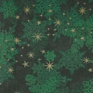 Zlaté hvězdičky a zelené vločky na tmavě zelené