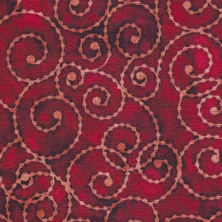 Oranžové spirály na červené makaté