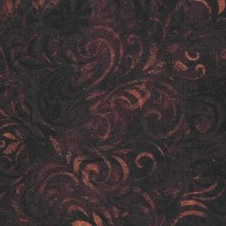 Světle hnědé lístečky a spirály na čokoládové