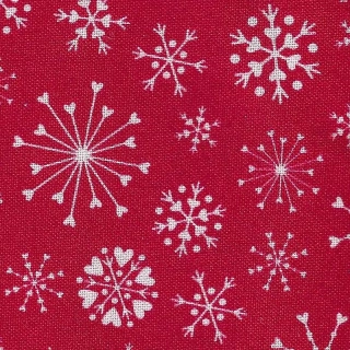 Bílé sněhové vločky na červené