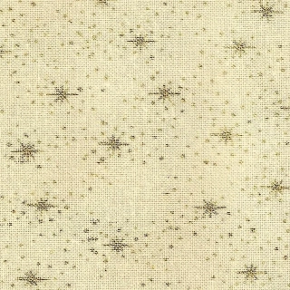 Zlaté hvězdičky a tečky na béžové makaté